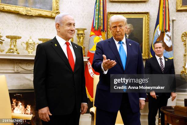President Donald Trump, accompanied by Israeli Prime Minister Benjamin Netanyahu , speaks during a meeting in the Oval Office of the White House on...