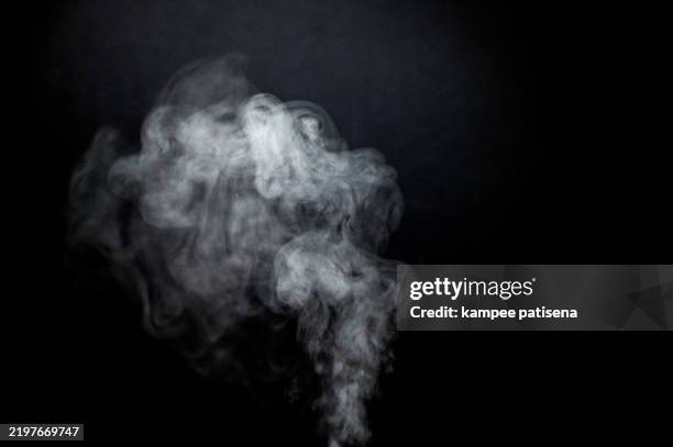 white smoke against black background - vapore foto e immagini stock