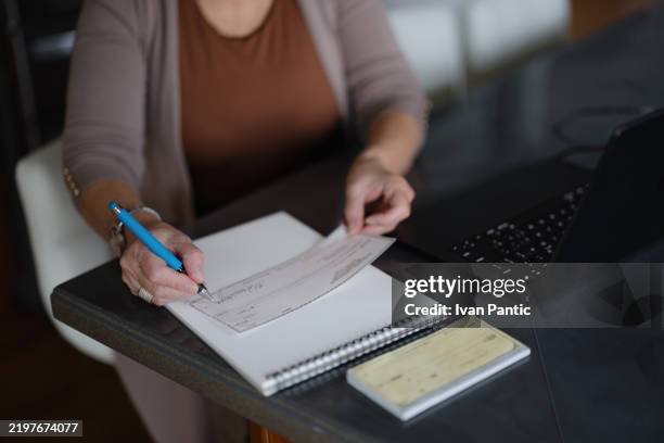Woman Writecheck 1,138 Writing A Check Stock Photos, High-Res Pictures, and Images ...