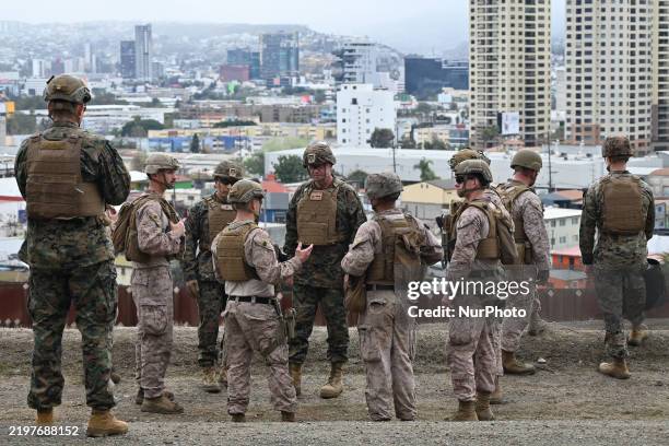United States Marine Corps troops patrol the US-Mexico border area as seen from San Diego, California, as the Defense Department deploys 1,600...