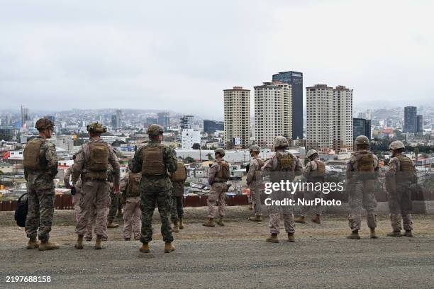 United States Marine Corps troops patrol the US-Mexico border area as seen from San Diego, California, as the Defense Department deploys 1,600...