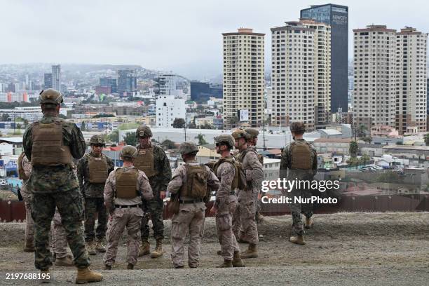 United States Marine Corps troops patrol the US-Mexico border area as seen from San Diego, California, as the Defense Department deploys 1,600...