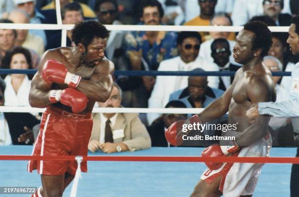 Michael "Dynamite" Dokes degfends his title against Mike "Hercules" Weaver during the WBA World Heavyweight Championship in Las Vegas, Nevada.