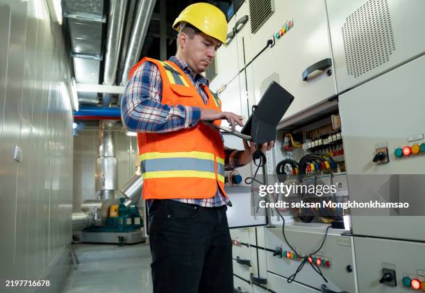 engineer working and check status switchgear electrical energy distribution at substation room - switchgear stock pictures, royalty-free photos & images