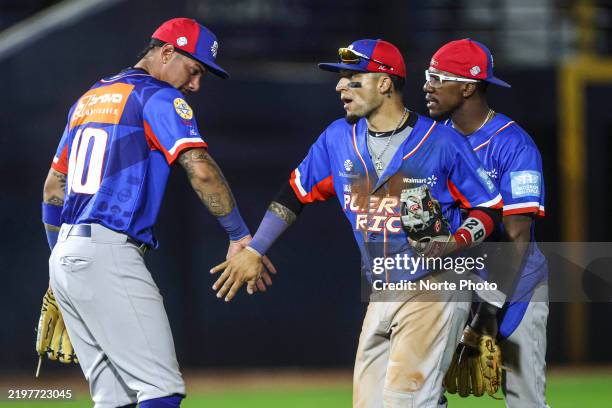 Players of the Mayaguez Indians of Puerto Rico celebrate victory over Leones del Escogido from the Dominican Republic, during the game between Puerto...