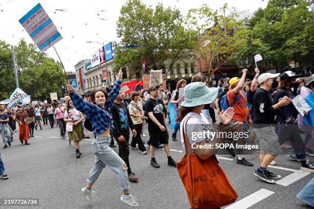 Protesters hold placards expressing their opinion during the rally. The National Day of Action calls for the reversal of Queensland's decision to...
