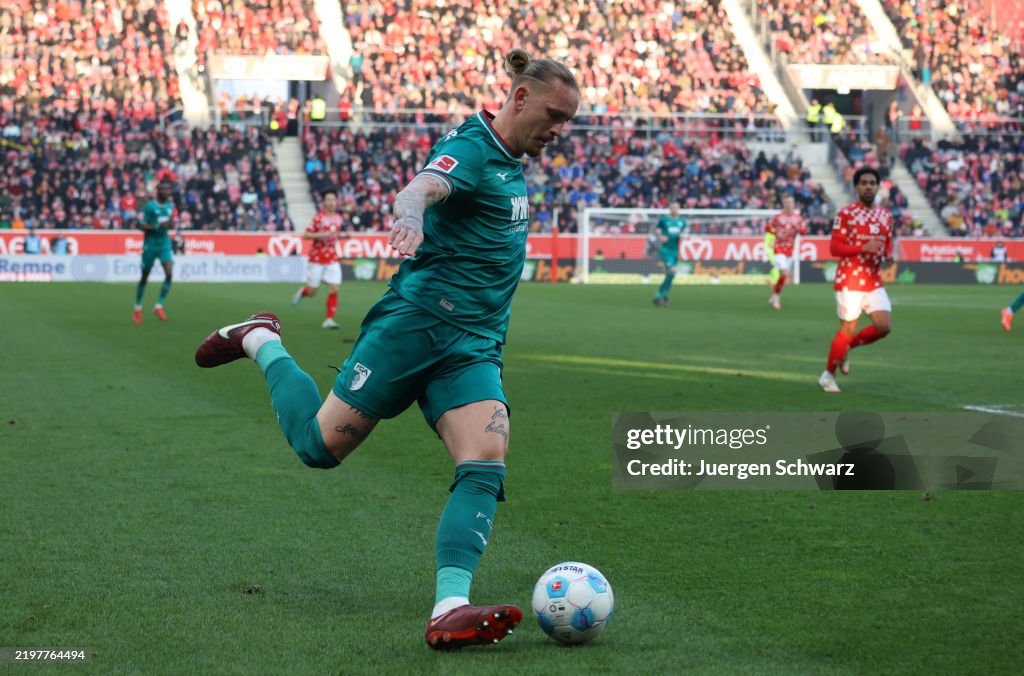 Mwolf Marius Wolf of Augsburg passes the ball during the Bundesliga match ...