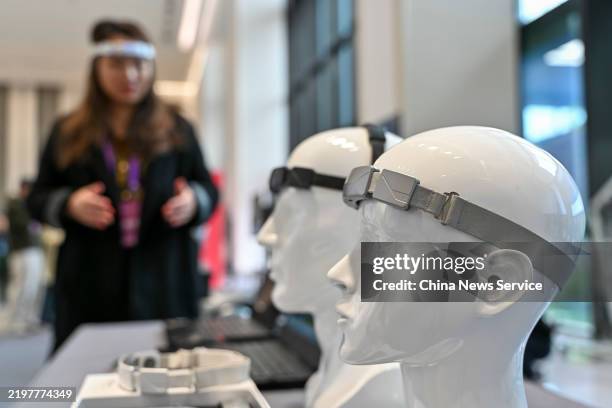 Brain-computer interface headbands are on display during the Guangdong Provincial High-quality Development Conference on February 5, 2025 in...