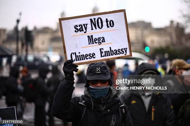 Protesters gather at the site of the former Royal Mint in London on February 8 to demonstrate against a proposal to move China's embassy to this...