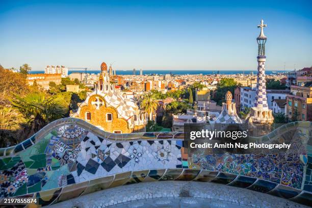 in gaudi's park guell, barcelona, a unesco world heritage centre. it features various mosaic-based artworks including a mosaic dragon which has become the symbol of barcelona. - barcelona spain stock pictures, royalty-free photos & images