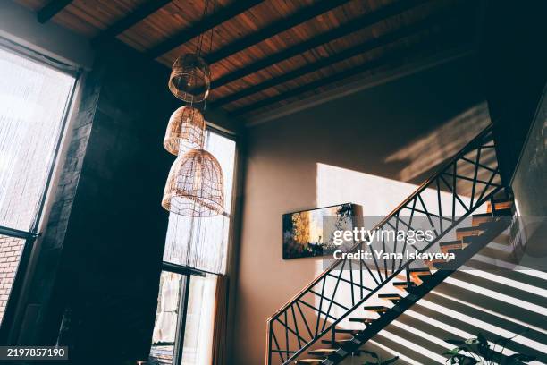 modern interior with sunlit decorations and abstract wall artwork - wall hanging stock pictures, royalty-free photos & images