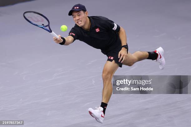 Kei Nishikori of Japan plays a shot against Tomas Machac of the Czech Republic in the Men's Singles Round of 32 match during day three of the 2025...
