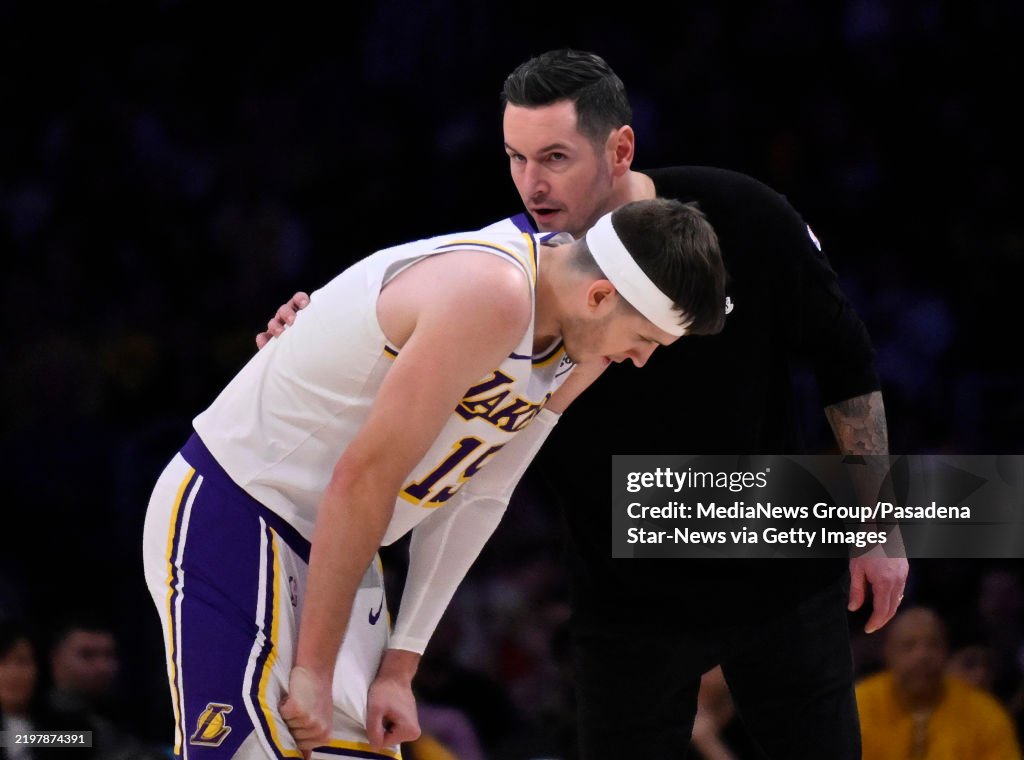Austin Reeves 2 Head coach JJ Redick of the Los Angeles Lakers speaks with Austin ...