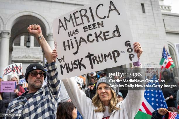 Los Angeles, CA Alex Skuby and his wife Mo Collins, of Valley Village, protest the Trump administration during a, 50 protests, 50 states, 1 day...