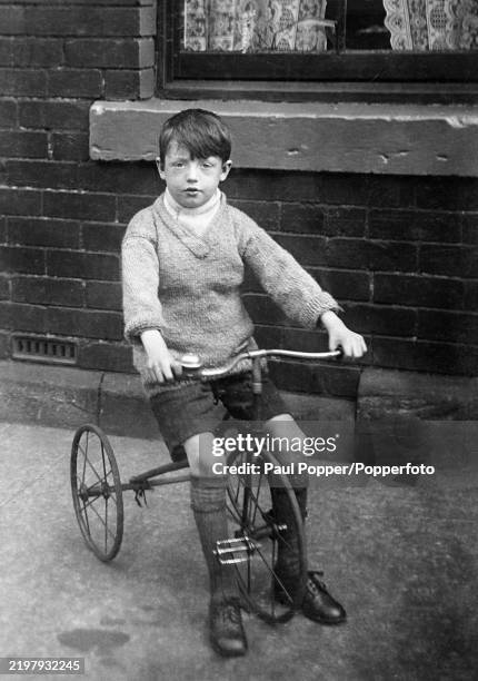 Vintage French postcard of young boy on his tricycle Vintage French postcard of young boy on his tricycle