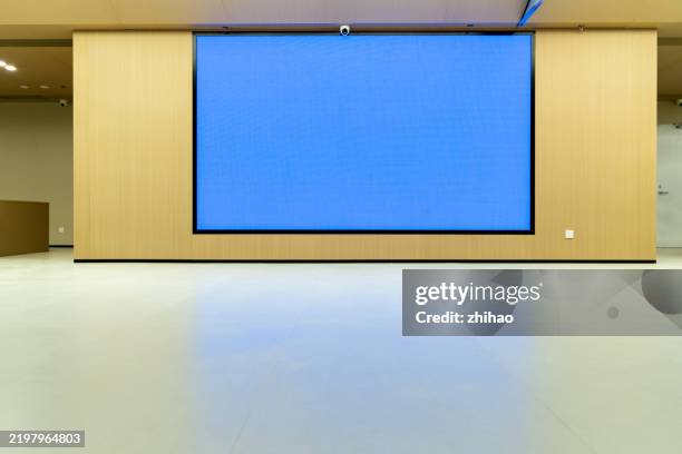 modern conference room with large blue screen - auditorium stock pictures, royalty-free photos & images