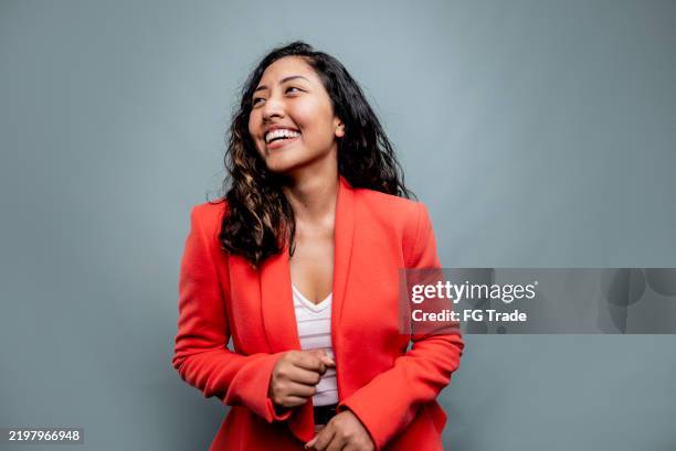 businesswoman contemplating on a gray background - looking away stock pictures, royalty-free photos & images