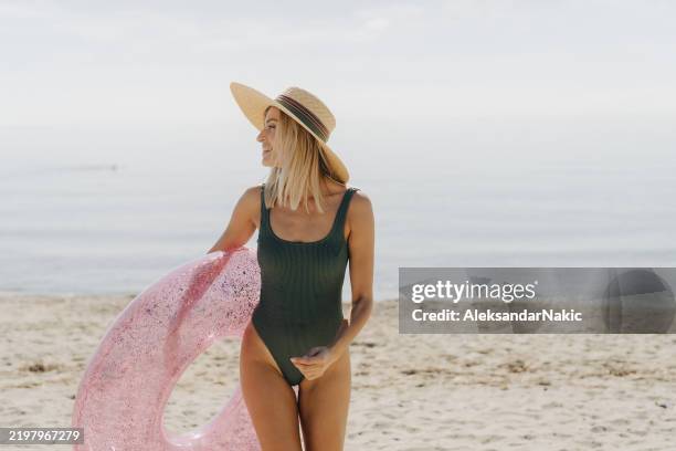 enjoying summer days at the beach - swimming costume stock pictures, royalty-free photos & images