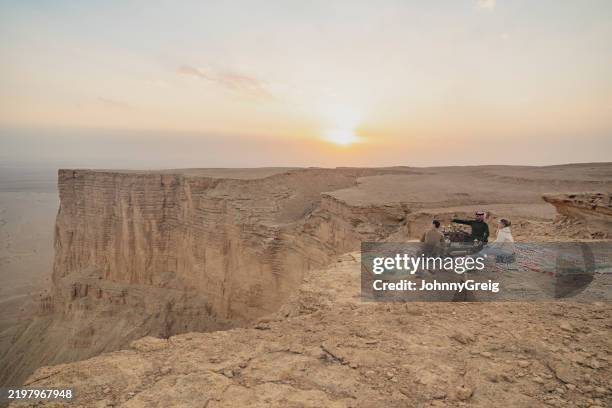 relaxing atop edge of the world in late afternoon - eco tourism stock pictures, royalty-free photos & images