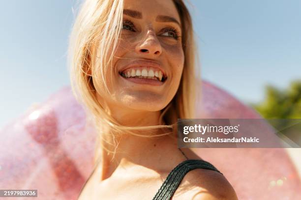 happy woman at the beach - mid adult stock pictures, royalty-free photos & images