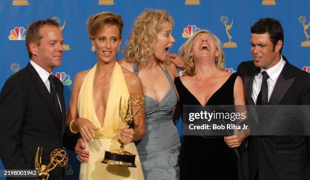 Television Show Actors : Kiefer Sutherland, Kim Raver, Jean Smart, and Carlos Bernard celebrate backstage at the Shrine Auditorium for The 58th...