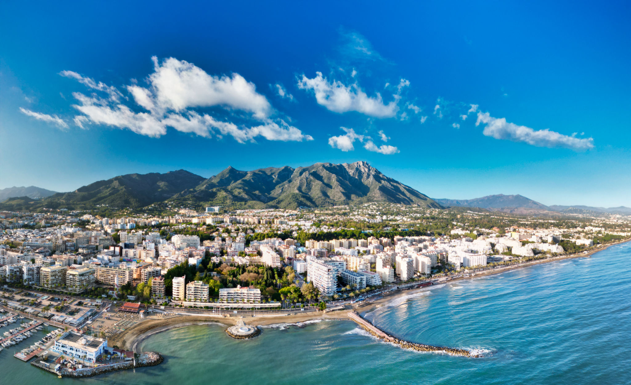 Stunning aerial view of Marbella with coastline, luxury villas, and Mediterranean Sea Stunning aerial view of Marbella with coastline, luxury villas, and Mediterranean Sea