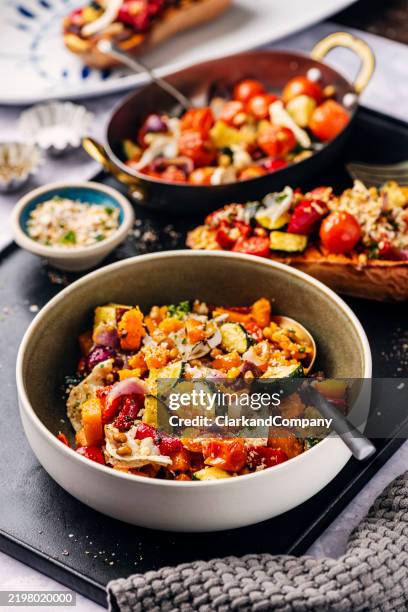 butternut squash with cherry tomatoes and goat's cheese- - butternut squash stock pictures, royalty-free photos & images