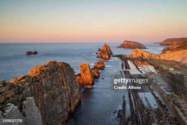 dramatic view of playa de la arnia, cantabria, spain. arnia beach, asturias at sunset. amazing landscape, lines, abstract shapes beautiful colors. - cantabria stock pictures, royalty-free photos & images
