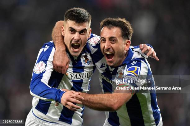 Ander Barrenetxea of Real Sociedad celebrates with teammate Mikel Oyarzabal after scoring his team's first goal during the Copa del Rey quarter-final...