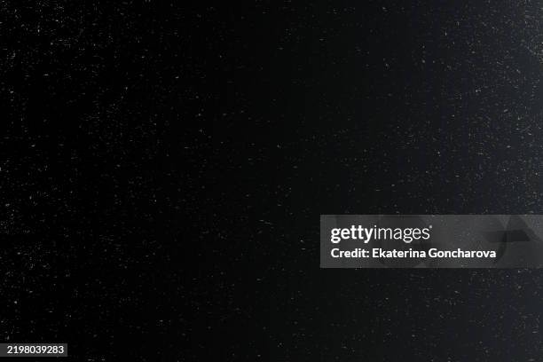 dark sky with countless stars and specks highlighting vast universe - dark sky stock pictures, royalty-free photos & images