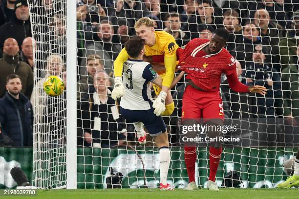 Ben Davies and Antonin Kinsky of Tottenham Hotspur clash heads during the Carabao Cup Semi Final Second Leg match between Liverpool and Tottenham...
