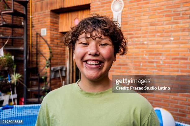 portrait of a transgender male in the backyard - transgender person stock pictures, royalty-free photos & images