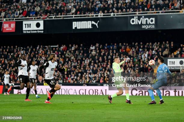 Ferran Torres of FC Barcelona scores his team's second goal during the Copa del Rey quarter-final match between Valencia CF and FC Barcelona at the...
