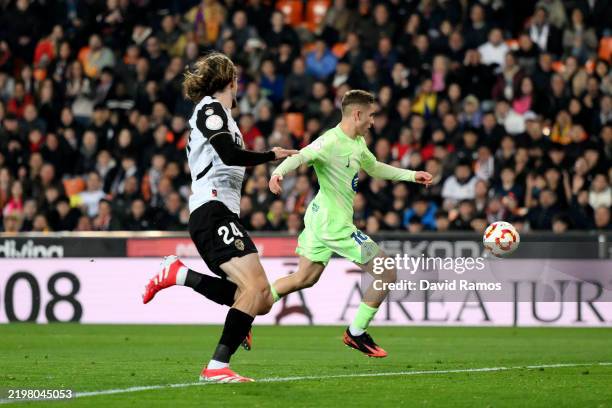 Fermin Lopez of FC Barcelona scores his team's third goal during the Copa del Rey quarter-final match between Valencia CF and FC Barcelona at the...