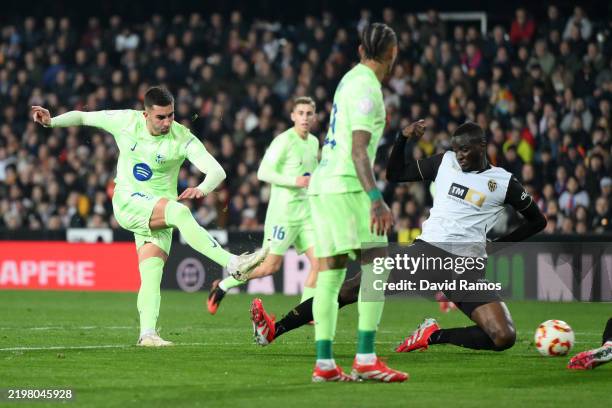 Ferran Torres of FC Barcelona scores his team's fourth goal to complete his hat-trick during the Copa del Rey quarter-final match between Valencia CF...
