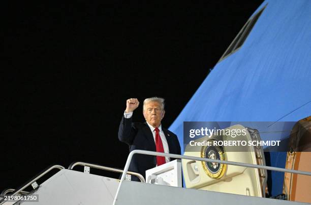 President Donald Trump boards Air Force One at Naval Air Station Joint Reserve Base New Orleans in Louisiana on February 9 as he returns to...