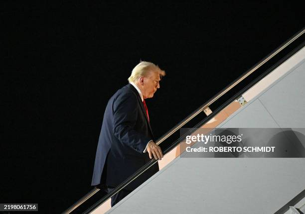 President Donald Trump boards Air Force One at Naval Air Station Joint Reserve Base New Orleans in Louisiana on February 9 as he returns to...