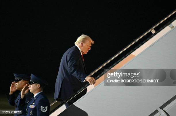 President Donald Trump boards Air Force One at Naval Air Station Joint Reserve Base New Orleans in Louisiana on February 9 as he returns to...