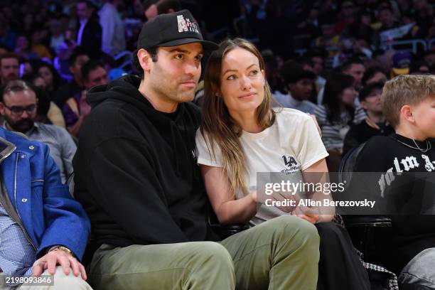 Dane Diliegro and Olivia Wilde attend a basketball game between the Los Angeles Lakers and the Golden State Warriors at Crypto.com Arena on February...