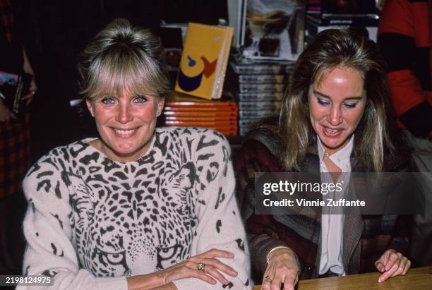 American actors Linda Evans and Pam Bellwood attend a book signing event at a B. Dalton bookstore for 'Dynasty : The Authorized Biography of the...