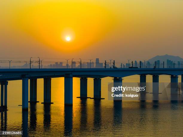 trucks driving on cross -sea roads - big l stock pictures, royalty-free photos & images