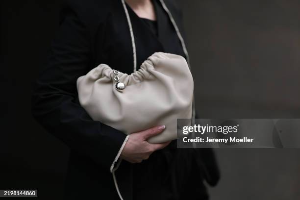 Maria Barteczko seen wearing WENDYKEI black tailored waistcoat, WENDYKEI black tailored blazer, WENDYKEI black cotton baggy pants and LOEWE...