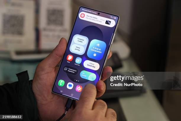 Samsung store owner shows the new Galaxy S25 Ultra 5G phone at a showroom in Sopore, Jammu and Kashmir, India, on February 10, 2025.