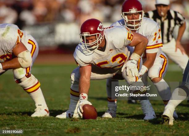 Steve DeBerg, Quarterback for the Kansas City Chiefs calls the play as Center and Guard Mike Webster prepares to make the snap on the line of...