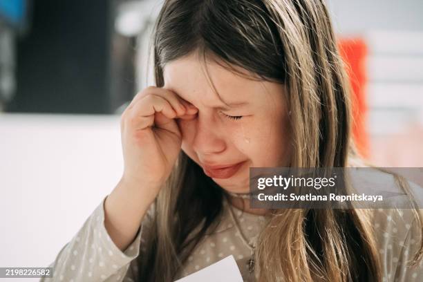 young girl crying in emotional moment - kid rubbing eyes stock pictures, royalty-free photos & images
