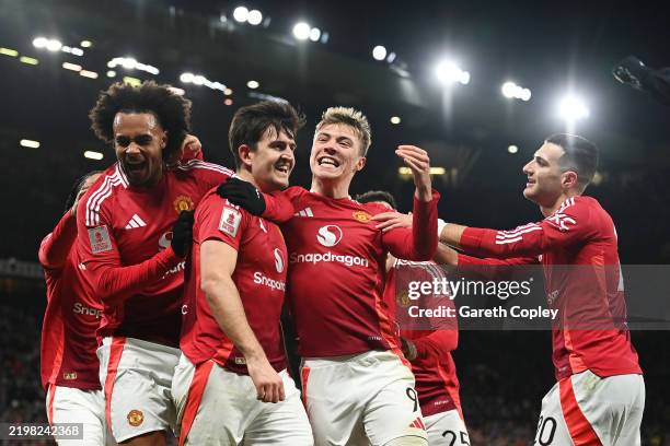 Harry Maguire of Manchester United celebrates scoring his team's second goal with team mates Joshua Zirkzee and Rasmus Hojlund during the Emirates FA...