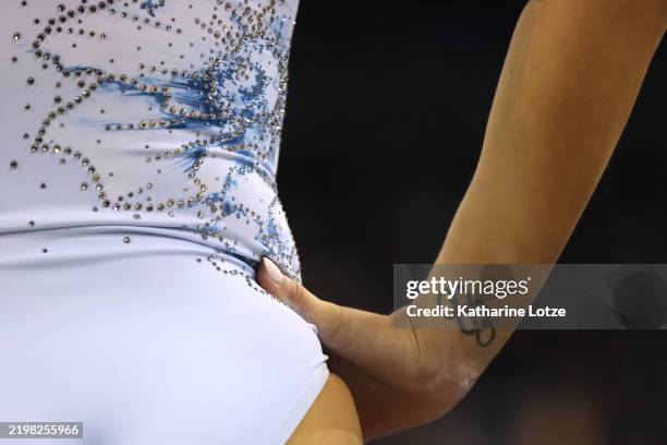 An Olympic rings tattoo is seen on Brooklyn Moors of the UCLA Bruins a meet against the Michigan State Spartans at Pauley Pavilion on February 01,...