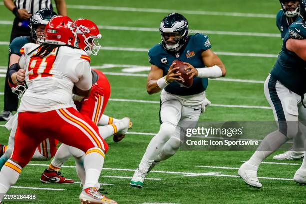 Jalen Hurts of the Philadelphia Eagles scrambles during Super Bowl LIX between the Kansas City Chiefs and the Philadelphia Eagles on Sunday, February...