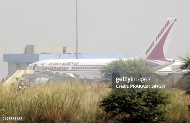 Hong Kong-bound Air India jet, which was delayed following a hoax call, is seen at Indira Gandhi international airport in New Delhi, 31 October 2002....