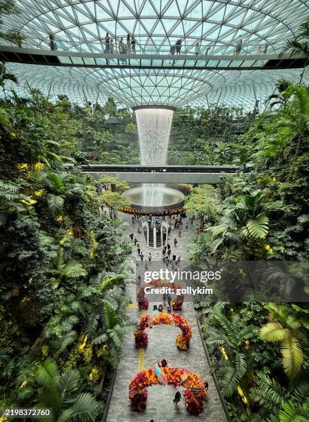 the rain vortex at jewel during chinese new year, changi airport, singapore - changi airport stock pictures, royalty-free photos & images